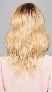Model is wearing ASPIRATION by GABOR in color SS-LIGHT-BLONDE | Light Blonde with Golden Highlights & Dark Brown Roots