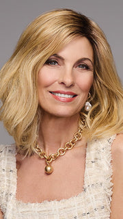 Model is wearing WAVER by GABOR in color SS-MEDIUM-BLONDE | Medium Blonde with Warm Highlights & Dark Brown Roots