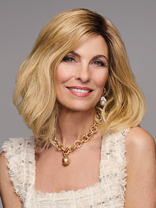 Model is wearing WAVER by GABOR in color SS-MEDIUM-BLONDE | Medium Blonde with Warm Highlights & Dark Brown Roots