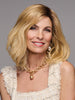 Model is wearing WAVER by GABOR in color SS-MEDIUM-BLONDE | Medium Blonde with Warm Highlights & Dark Brown Roots
