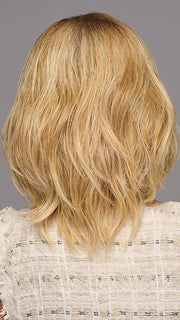 Model is wearing WAVER by GABOR in color SS-MEDIUM-BLONDE | Medium Blonde with Warm Highlights & Dark Brown Roots