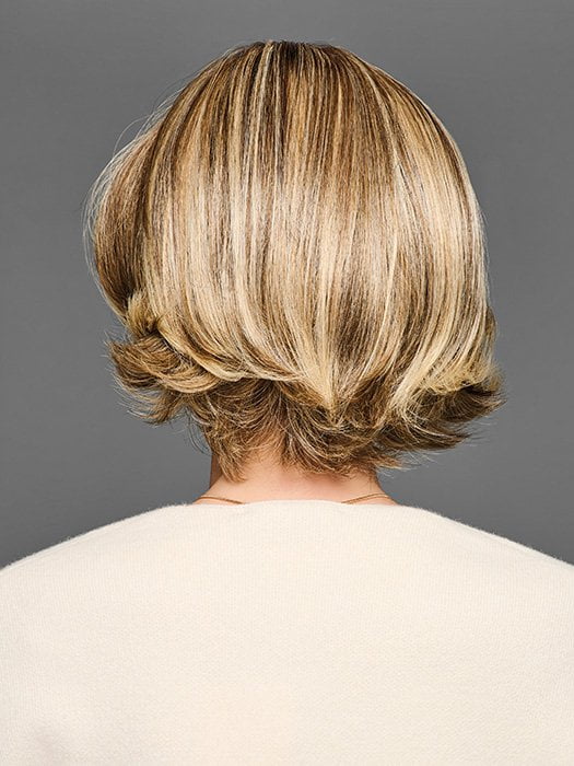 Model is wearing STAND OUT STYLE by GABOR in color GF12-22SS SHADED CAPPUCCINO | Light Golden Brown Evenly Blended with Cool Platinum Blonde Highlights with Dark Roots