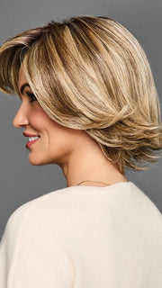 Model is wearing STAND OUT STYLE by GABOR in color GF12-22SS SHADED CAPPUCCINO | Light Golden Brown Evenly Blended with Cool Platinum Blonde Highlights with Dark Roots