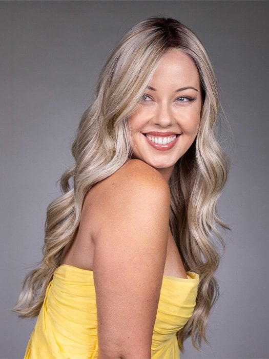 Model is wearing GISELE by BELLETRESS in color BUTTERBEER R | Dark Brown Base and Root that transitions smoothly into a buttery blonde, infused with creamy honey and toffee tones
