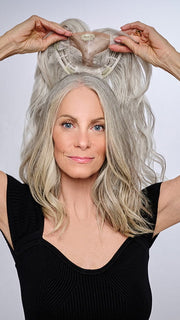 Model is wearing 16" AU NATUREL WAVES TOPPER by HAIRDO in color R56/60 SILVER MIST | Lightest Gray with 20% Medium Brown Evenly Blended with Pure White