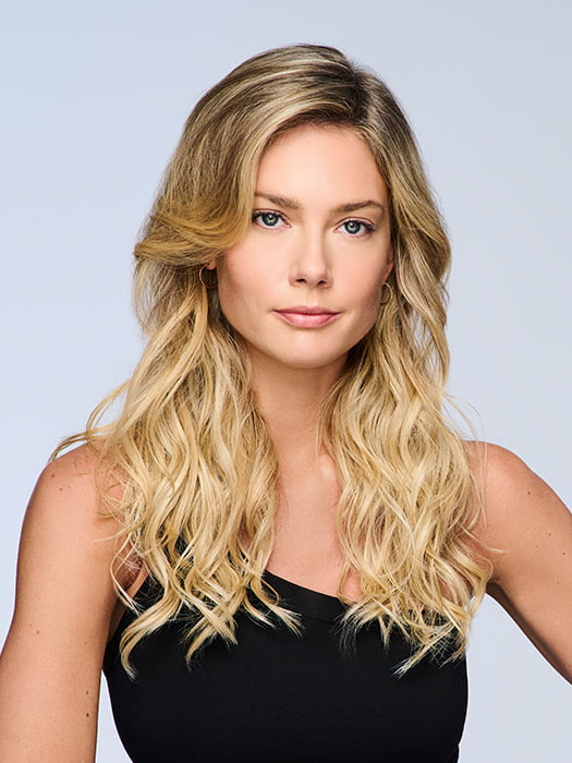Model is wearing 18" VOLUME EXTENSION by HAIRDO in color SS14/88H SHADED GOLDEN WHEAT | Dark Blonde Evenly Blended with Pale Blonde Highlights and Dark Roots