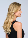 Model is wearing 18" VOLUME EXTENSION by HAIRDO in color SS14/88H SHADED GOLDEN WHEAT | Dark Blonde Evenly Blended with Pale Blonde Highlights and Dark Roots