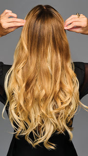 Model is wearing 19IN WAVY INVISIBLE EXTENSION by HAIRDO in color SS14/88H SHADED GOLDEN WHEAT | Dark Blonde Evenly Blended with Pale Blonde Highlights and Dark Roots