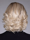 Model is wearing HELSINKI by BELLETRESS in color CRUSHED ALMOND BLONDE R | A soft Neutral Light Blonde with a Light and Medium Blended Root Color.