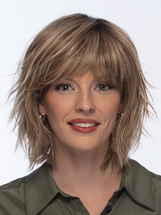 Model is wearing HOLLIS by ESTETICA in color RH12/26RT4 | Light Brown with Chunky Golden Blonde Highlights & Dark Brown Roots