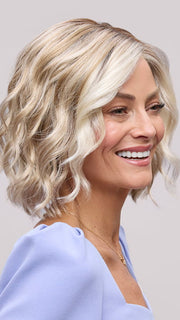 Model is wearing JANUARY PETITE by JON RENAU in color 101/88/27S8 CATALINA BLONDE | Pale blonde with Pure White Natural Violet halo highlights, shaded medium brown