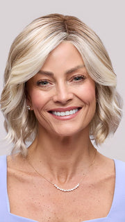 Model is wearing JANUARY PETITE by JON RENAU in color 101/88/27S8 CATALINA BLONDE | Pale blonde with Pure White Natural Violet halo highlights, shaded medium brown