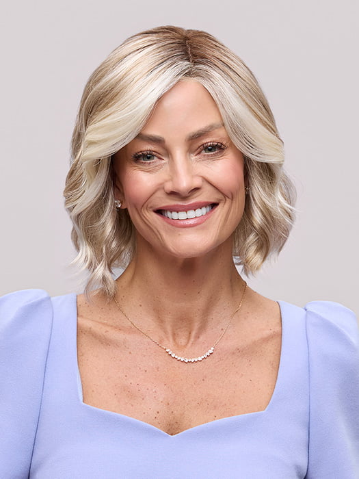 Model is wearing JANUARY PETITE by JON RENAU in color 101/88/27S8 CATALINA BLONDE | Pale blonde with Pure White Natural Violet halo highlights, shaded medium brown