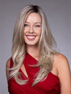 Model is wearing KARINA by BELLETRESS in color BUTTERBEER R | Dark Brown Base and Root that transitions smoothly into a buttery blonde, infused with creamy honey and toffee tones
