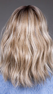 Model is wearing KARLIE by BELLETRESS in color BUTTERBEER R | Dark Brown Base and Root that transitions smoothly into a buttery blonde, infused with creamy honey and toffee tones