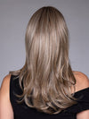 Model is wearing MARSEILLE by BELLETRESS in color MACADAMIA LATTE R | A combination of Medium and Light Brown, highlighted with Light Gold Blonde, and a mixture of Ash Blonde and Light Gold Blonde, Rooted with Medium and Light Brown