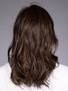 Model is wearing MUNICH by BELLETRESS in color MOCHA MAPLE BROWN | A mix of Dark Brown, Medium Brown, Light Auburn, Medium Strawberry