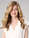 Model is wearing MAYA HAND TIED by ENVY in color SPARKLING CHAMPAGNE | Medium Brown roots with overall Strawberry Blonde base and soft Golden Blonde highlights