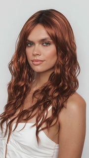 Model is wearing PHILLIPA by RENE OF PARIS in color CAFE ROUGE R | A dimensional auburn copper blend with rich reddish-brown roots melting into warm copper highlights