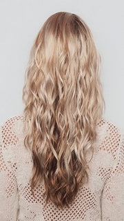 Model is wearing PHILLIPA by RENE OF PARIS in color WINTER OAT LATTE R | rooted honey blonde and platinum blonde blend with soft, dimensional highlights and lowlights