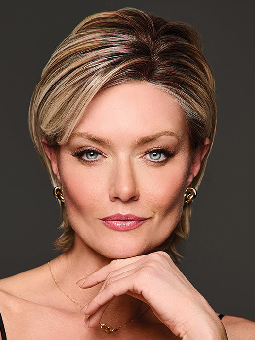 Model is wearing BOUTIQUE CHIC by RAQUEL WELCH in RL19/23SS SHADED BISCUIT | Light Ash Blonde Evenly Blended with Cool Platinum Blonde with Dark Roots