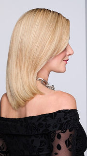 Model is wearing MIDNIGHT IN PARIS by RAQUEL WELCH in color RH14/88SS SHADED GOLDEN WHEAT | Dark Blonde Evenly Blended with Pale Blonde Highlights that extend from dark roots to ends