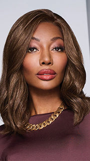 Model is wearing SORRENTO SURPRISE by RAQUEL WELCH in color RL8/12SS SHADED MOCHA | Medium Brown with Dark Blonde highlights from roots to ends