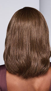 Model is wearing SORRENTO SURPRISE by RAQUEL WELCH in color RL8/12SS SHADED MOCHA | Medium Brown with Dark Blonde highlights from roots to ends