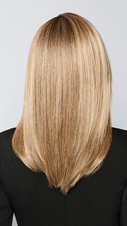 Model is wearing BOX OFFICE BEAUTY by RAQUEL WELCH in color SS1621 SHADED SAND | Light Blonde shaded with Medium Brown