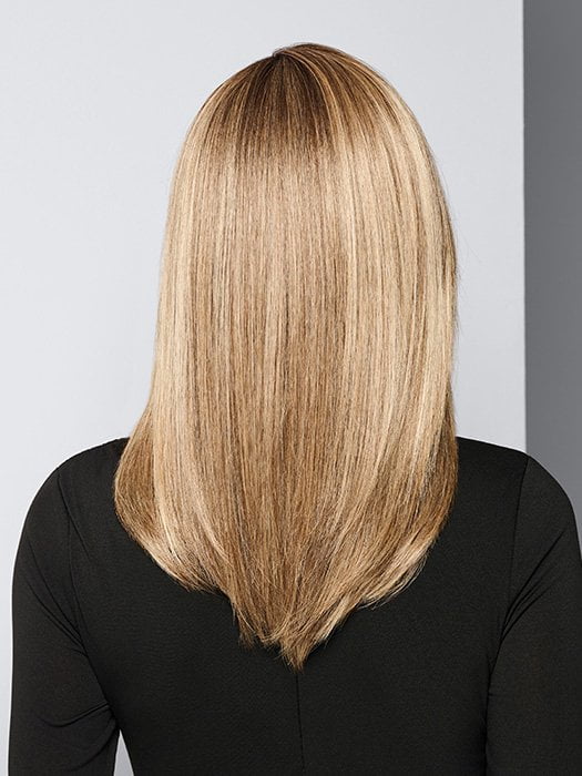 Model is wearing BOX OFFICE BEAUTY by RAQUEL WELCH in color SS1621 SHADED SAND | Light Blonde shaded with Medium Brown