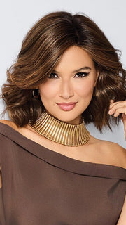 Model is wearing STEAL THE SHOW by RAQUEL WELCH in color SS8/29 SHADED HAZELNUT | Rich Medium Brown Evenly Blended with Ginger Blonde Highlights with Dark Roots