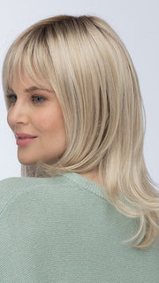 Model is wearing ROMA by ESTETICA in color SUNLIT-BLONDE | Soft Blend of Sandy Blonde, Lightest Blonde & Iced Blonde with a Light Golden Brown Roots