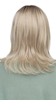 Model is wearing ROMA by ESTETICA in color SUNLIT-BLONDE | Soft Blend of Sandy Blonde, Lightest Blonde & Iced Blonde with a Light Golden Brown Roots