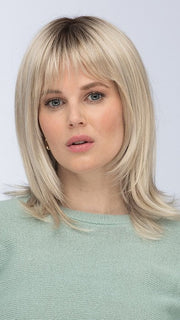 Model is wearing ROMA by ESTETICA in color SUNLIT-BLONDE | Soft Blend of Sandy Blonde, Lightest Blonde & Iced Blonde with a Light Golden Brown Roots