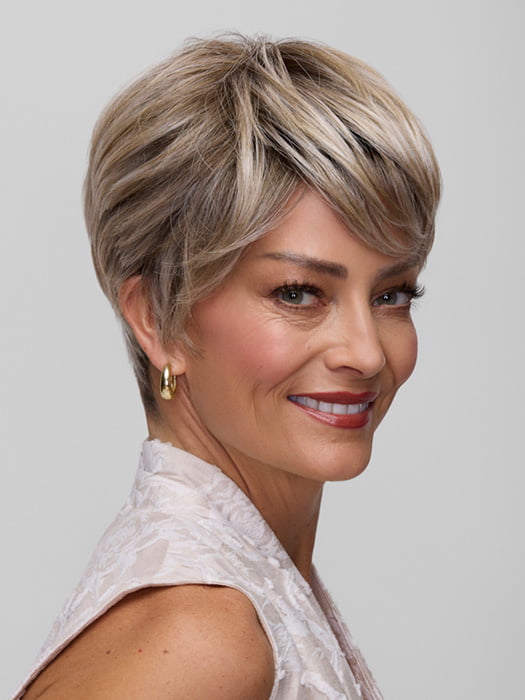 Model is wearing TESS PETITE by JON RENAU in color FS17/101S18 PALM SPRINGS BLONDE | Light Ash Blonde with Pure White Natural Violet Bold Highlights, Shaded with Dark Natural Ash Blonde