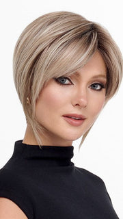 Model is wearing THE ROUGE by TRESSALLURE in color 36/25/23/R6 MOON DUST | Dark salt and pepper base with blended golden blonde and cool platinum tones, shaded with Dark Roots