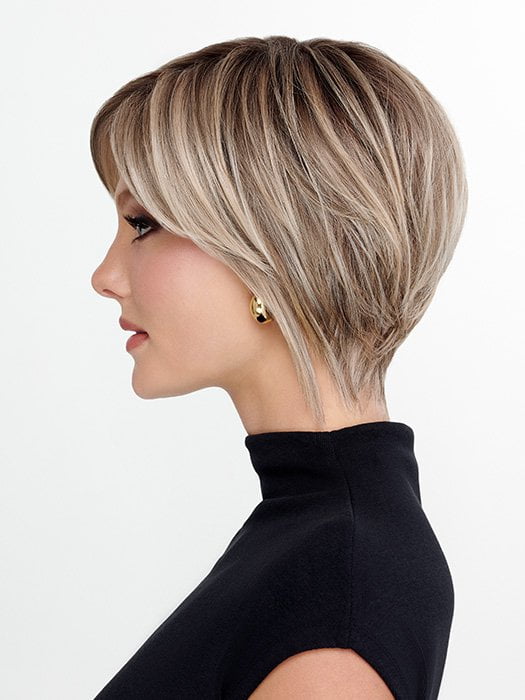 Model is wearing THE ROUGE by TRESSALLURE in color 36/25/23/R6 MOON DUST | Dark salt and pepper base with blended golden blonde and cool platinum tones, shaded with Dark Roots