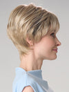 Model is wearing TIFFANY HAND TIED by ENVY in color SILKY BEIGE | Light Platinum Blonde with Dark Brown Roots