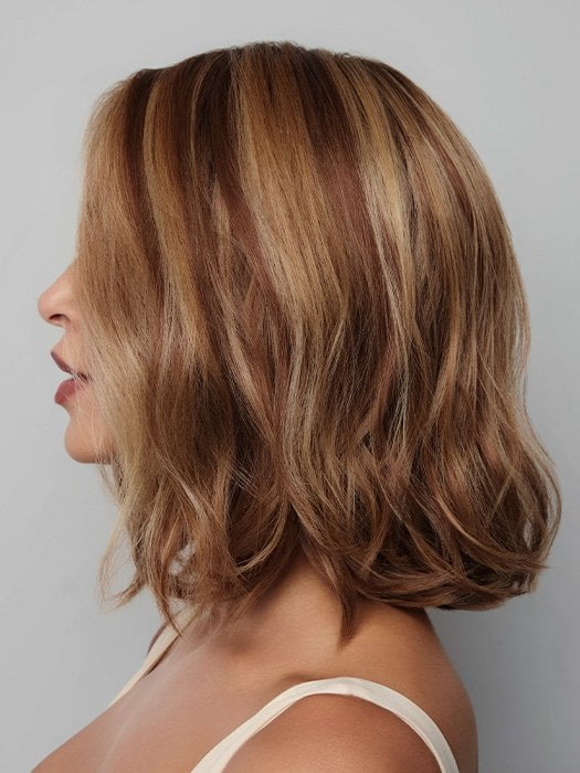 Model is wearing YUI by NORIKO in color GLAZED CARAMEL R | Warm Brown and Dark Blonde Tones with Ashy Highlights and a Dark Root