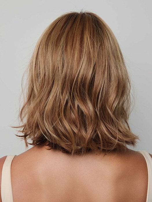 Model is wearing YUI by NORIKO in color GLAZED CARAMEL R | Warm Brown and Dark Blonde Tones with Ashy Highlights and a Dark Root