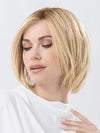 Model is wearing JADORE DELUXE by ELLEN WILLE in color LIGHT CHAMPAGNE ROOTED | Lightest Pale Blonde and Lightest Golden Blonde with Winter White Blend and Shaded Roots