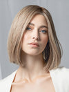 Model is wearing Supreme Plus Deluxe by Ellen Wille in color SAND MULTI ROOTED 15.22.14 | Light Ash Blonde and Light Neutral Blonde with Medium Ash Blonde Blend and Shaded Roots