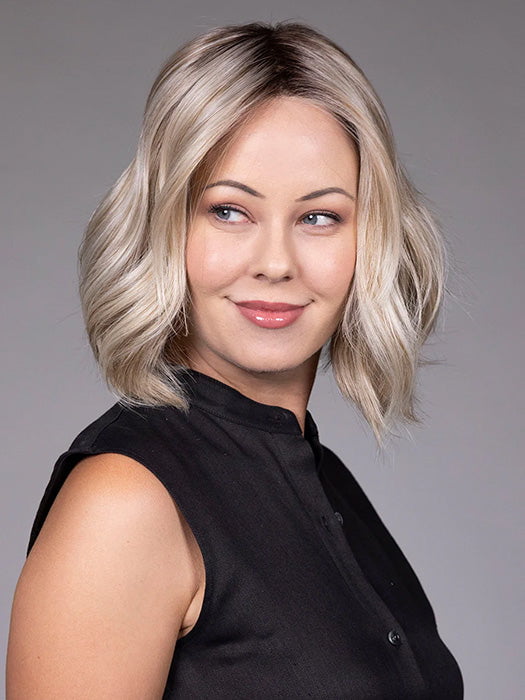 Model is wearing AMI in color BUTTER BEER R | A rich blend of warm brunette and golden honey highlights finished with a soft, natural root.