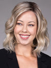 Model is wearing VERONICA in Butter Beer R | Dark Brown Base and Root that transitions smoothly into a buttery blonde, infused with creamy honey and toffee tones