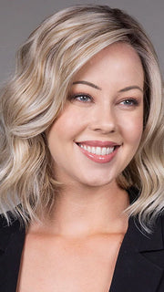 Model is wearing VERONICA in Butter Beer R | Dark Brown Base and Root that transitions smoothly into a buttery blonde, infused with creamy honey and toffee tones