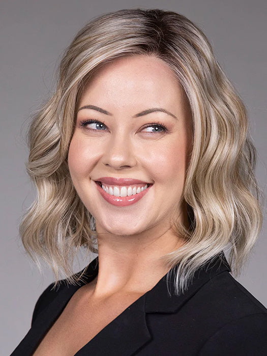 Model is wearing VERONICA in Butter Beer R | Dark Brown Base and Root that transitions smoothly into a buttery blonde, infused with creamy honey and toffee tones