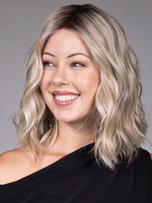 Model is wearing ANDIE in color BUTTER BEER R | A rich blend of warm brunette and golden honey highlights finished with a soft, natural root.