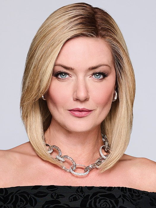 Model is wearing MIDNIGHT IN PARIS by RAQUEL WELCH in color RH14/88SS SHADED GOLDEN WHEAT | Dark Blonde Evenly Blended with Pale Blonde Highlights that extend from dark roots to ends