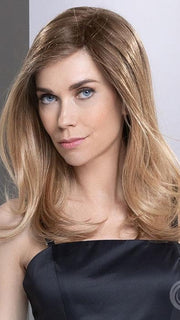 Model is wearing SAVELLI in color BERNSTEIN MULTI TIPPED 12.27.26 | Medium Brown and Lightest Brown with Dark Strawberry Blonde and Light Honey Blonde Blend and Lighter Tipped Ends