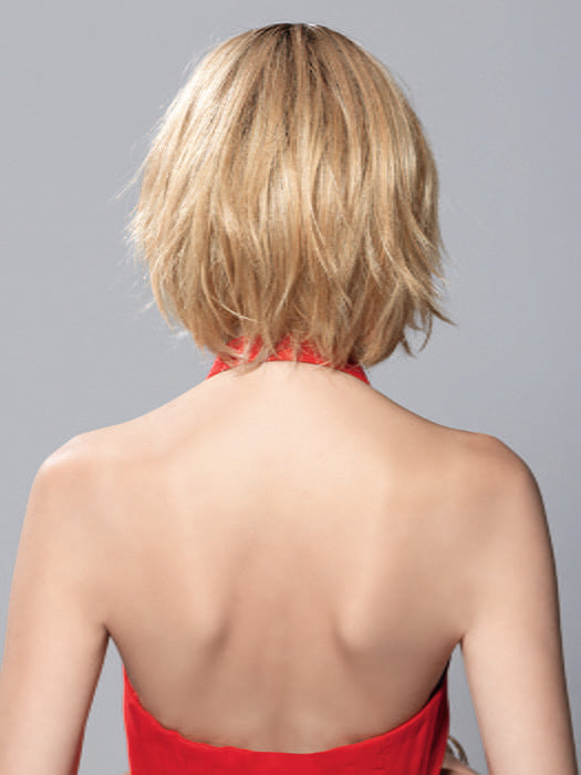 Model is wearing TESS MONO PART by ELLEN WILLE in color SAHARA BEIGE ROOTED | Light Golden Blonde and Lightest Golden Blonde with Light Honey Blonde Blend and Shaded Roots